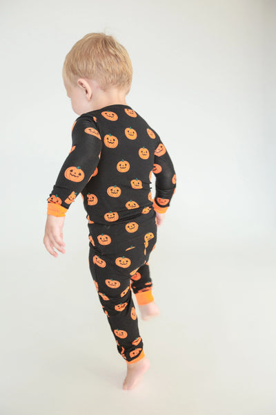 black 2 piece pajamas set with orange jack-o-lanterns