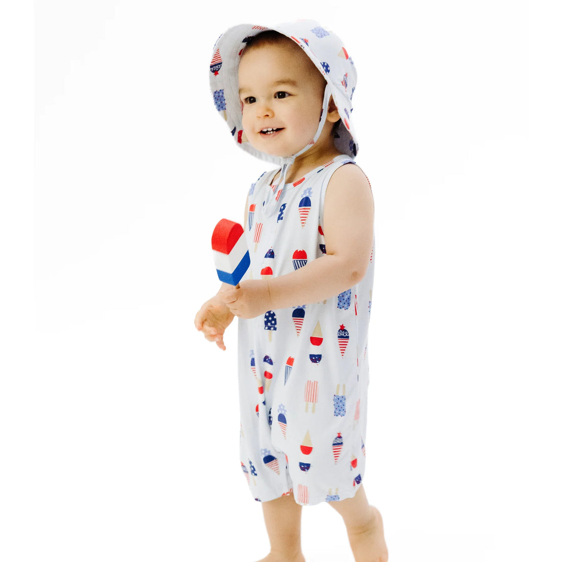 blue sleeveless baby romper with red white and blue ice cream all over