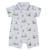 Baby romper with golf-themed print on a white background