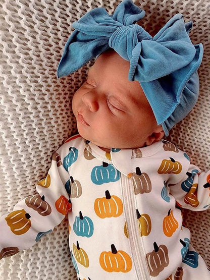 baby romper with blue, tan, orange and gray pumpkins all over