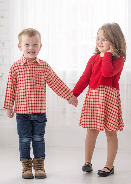 girl and boy, girl is wearing dress and boy is wearing a matching plaid top