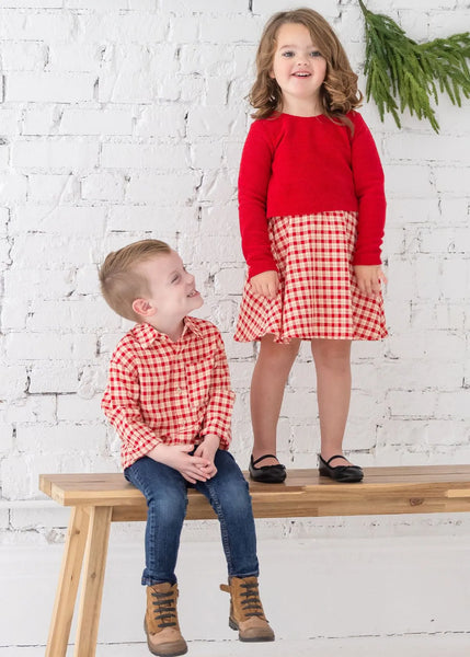 boy and girl wearing matching plaid