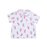White polo shirt with red lobster pattern on a white background