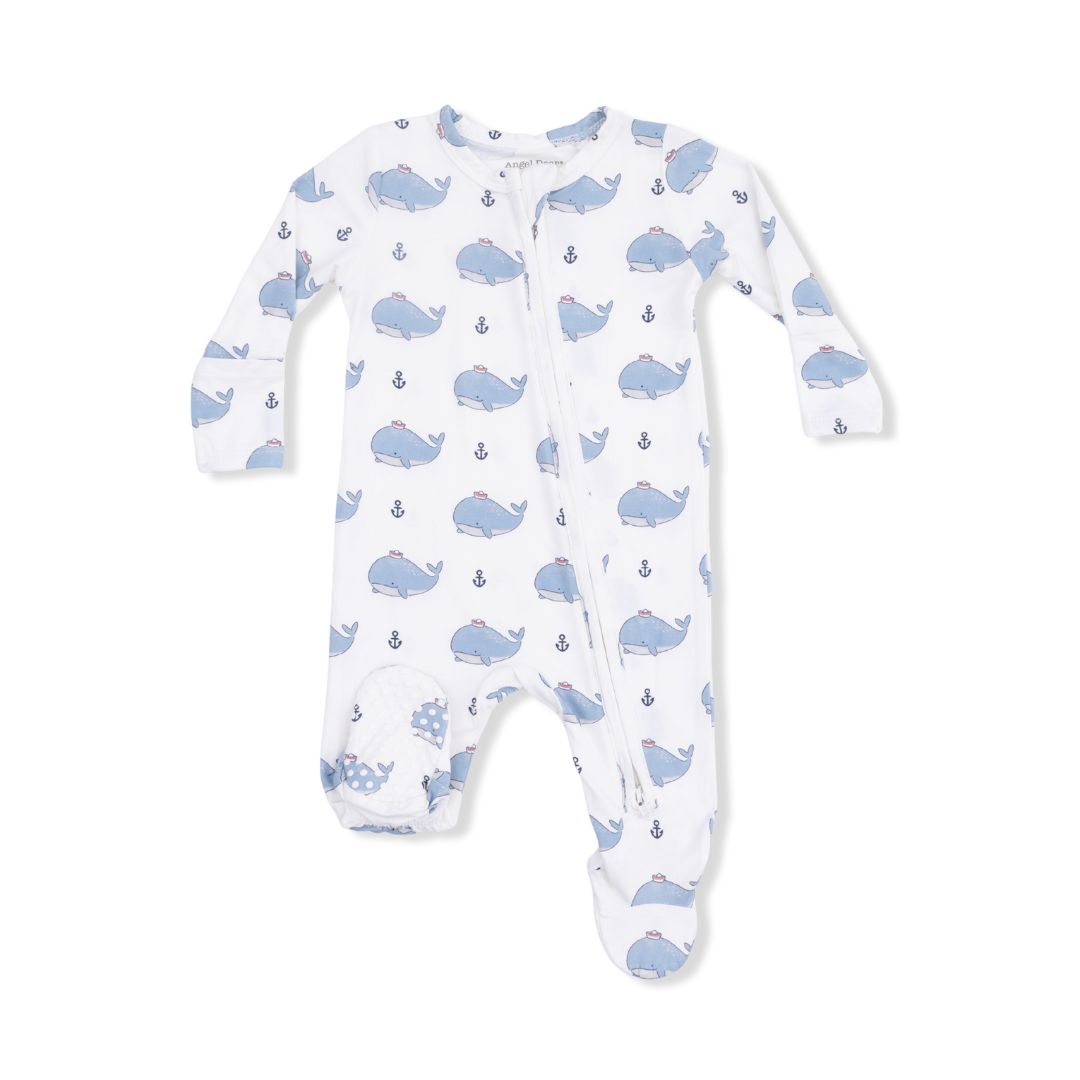 Baby onesie with blue whale pattern on a white background