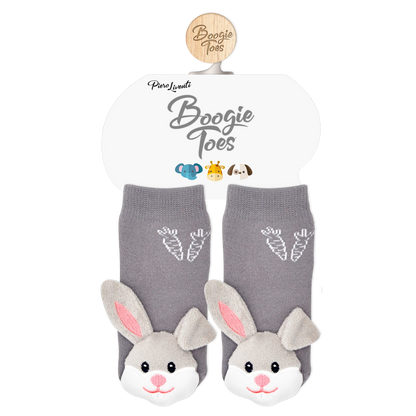Gray bunny slippers with pink ears and carrot designs on a white background, featuring the brand &
