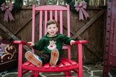 boy wearing green sweater with rudolph face