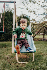 boy wearing green sweater with rudolph face