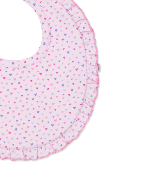 close up of bib with multi hearts