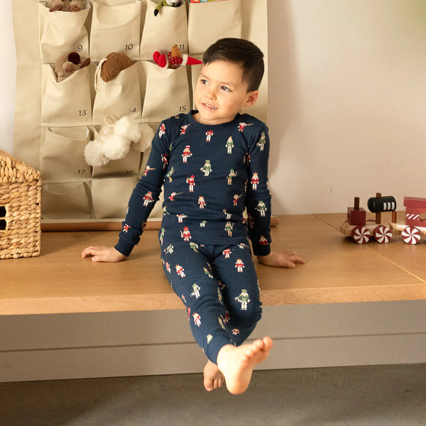 long sleeve navy pajamas with red and green nutcrackers all over - boy wearing