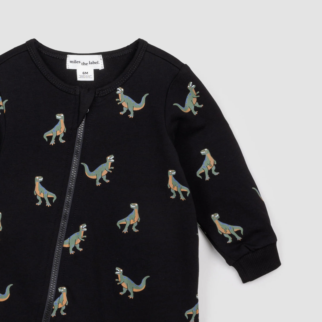 black playsuit with t-rex all over
