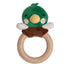 Green plush toy with a wooden ring on a white background