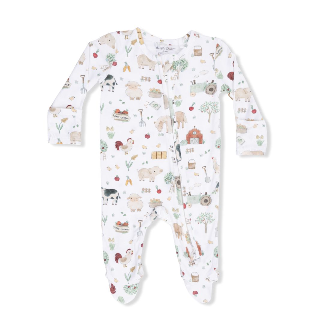 Baby onesie with farm animal pattern on a white background