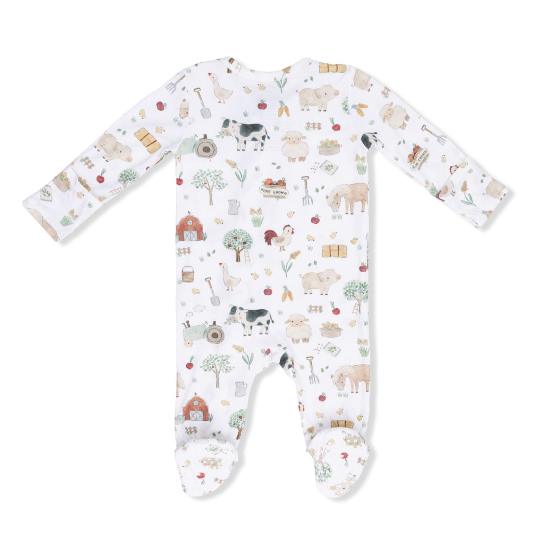 Baby onesie with farm animal pattern on a white background
