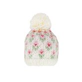 Knitted beanie with floral pattern and white pom-pom on a white background
