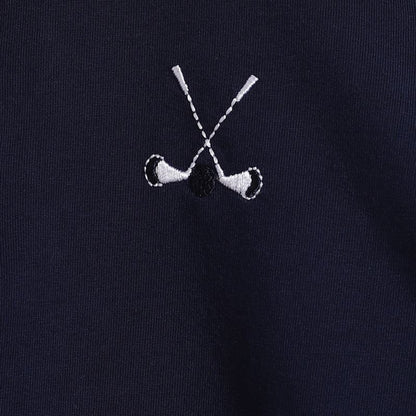 Embroidered design of two crossed golf clubs on a black background