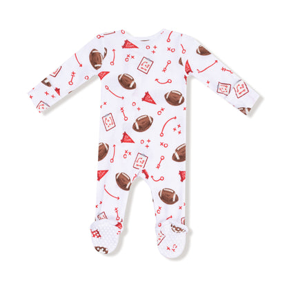 Baby onesie with football pattern on a white background