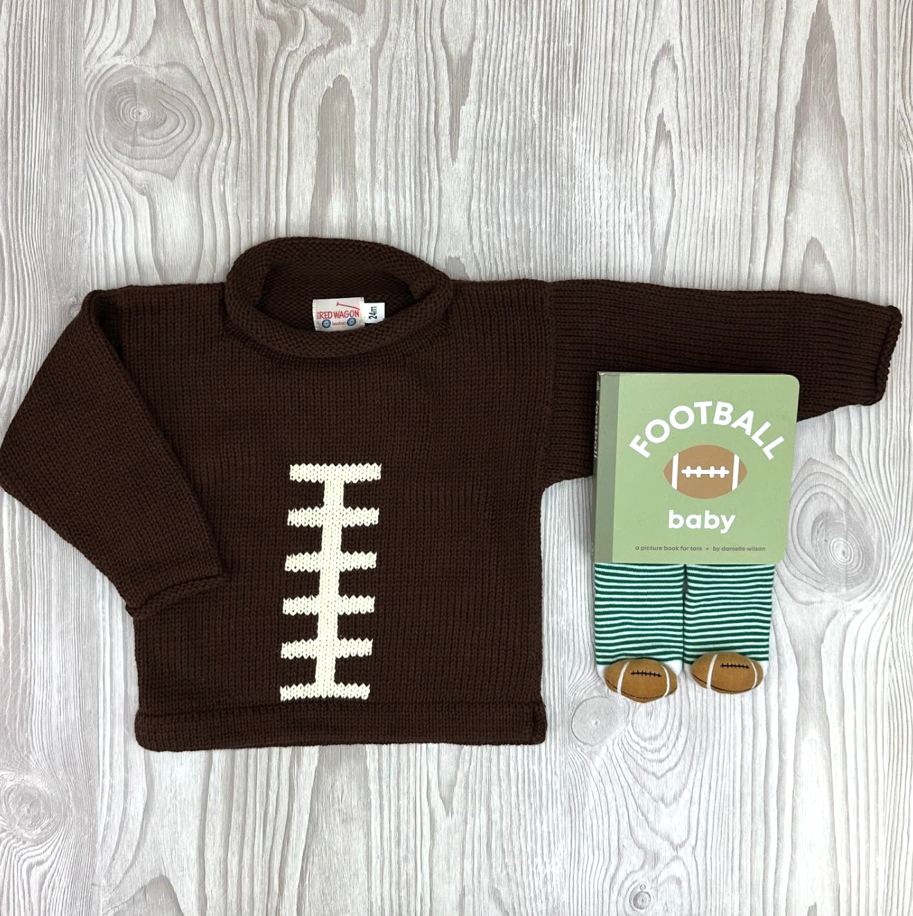 brown football sweater with football socks and football book