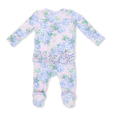 Baby onesie with floral pattern and ruffle details on a white background