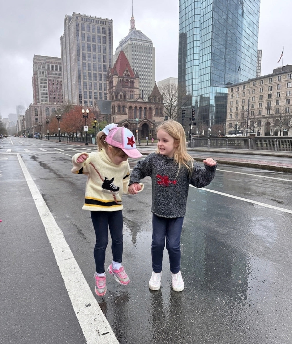 two girls wearing red wagon sweaters in boston