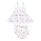 Baby dress and bloomers set with golf pattern on a white background