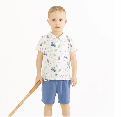 little boy wearing golf outfit