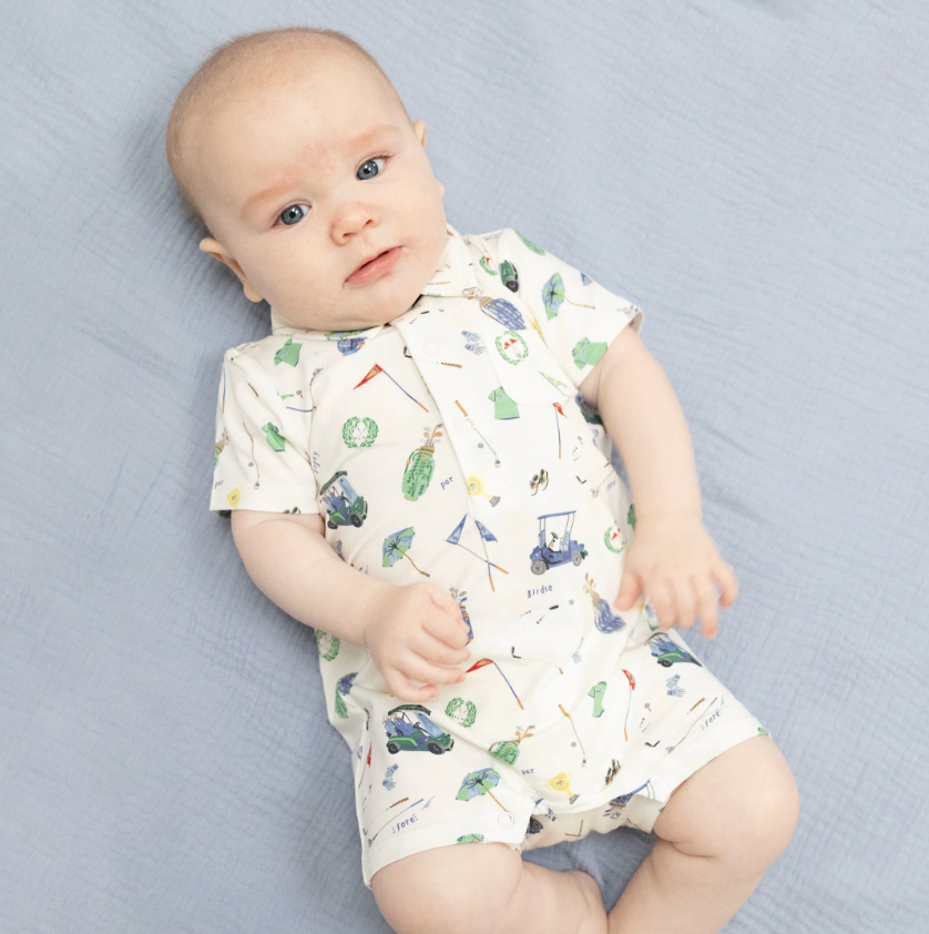 baby wearing golf romper