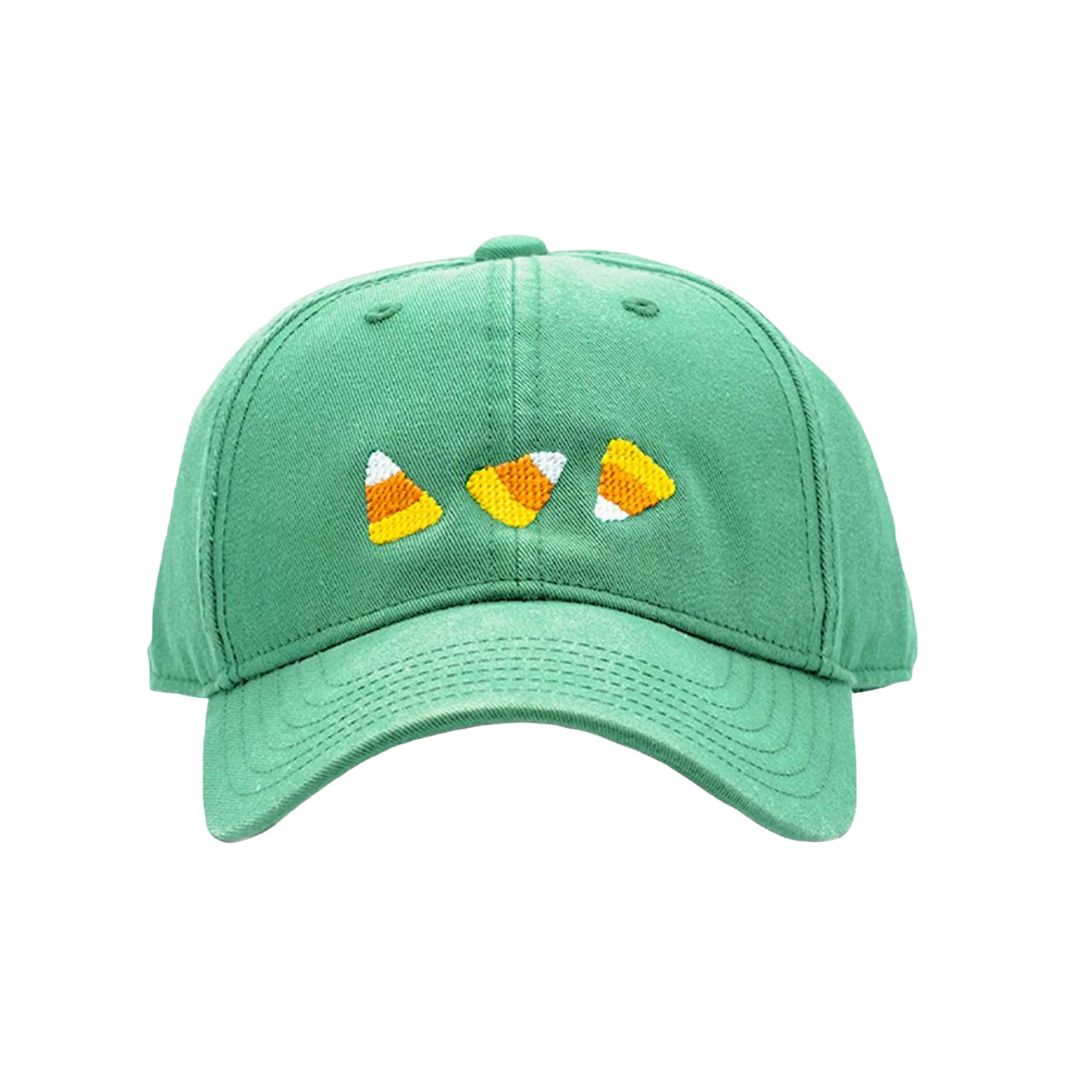 Green cap with candy corn designs on a white background