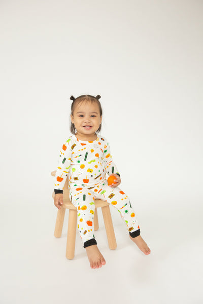 ivory 2 piece pajamas with Halloween candies all over