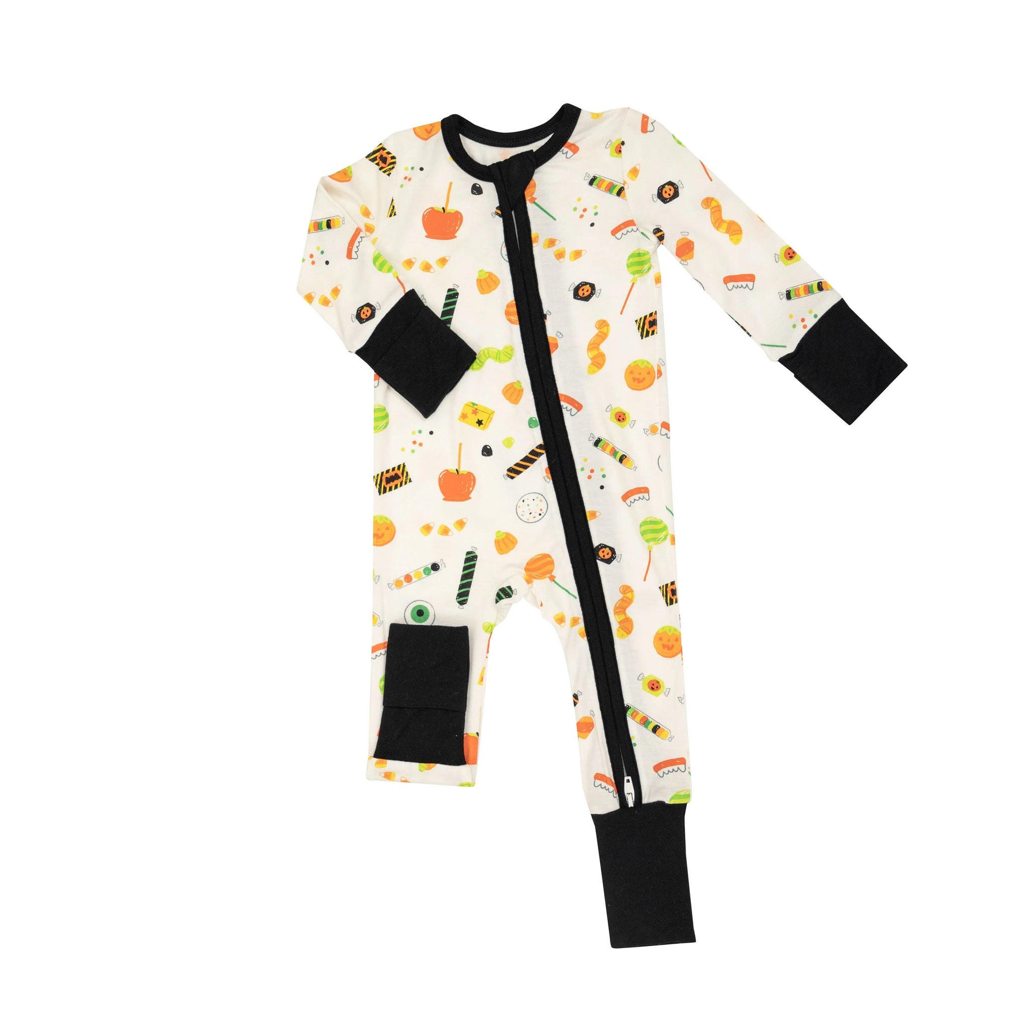 ivory romper with Halloween candies all over and black contrast cuffs
