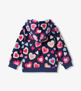 A navy blue fleece hoodie with an all-over heart pattern in pink, red, and light blue, shown from the back on a light gray background.