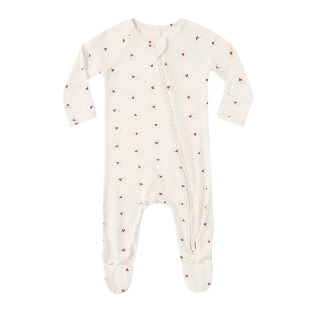 Baby onesie with heart pattern on a white background
