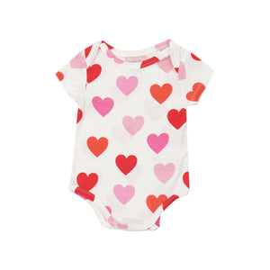 white short sleeve onesie with pink and red hearts all over
