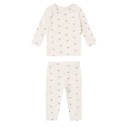 Baby pajamas with heart pattern on a white background