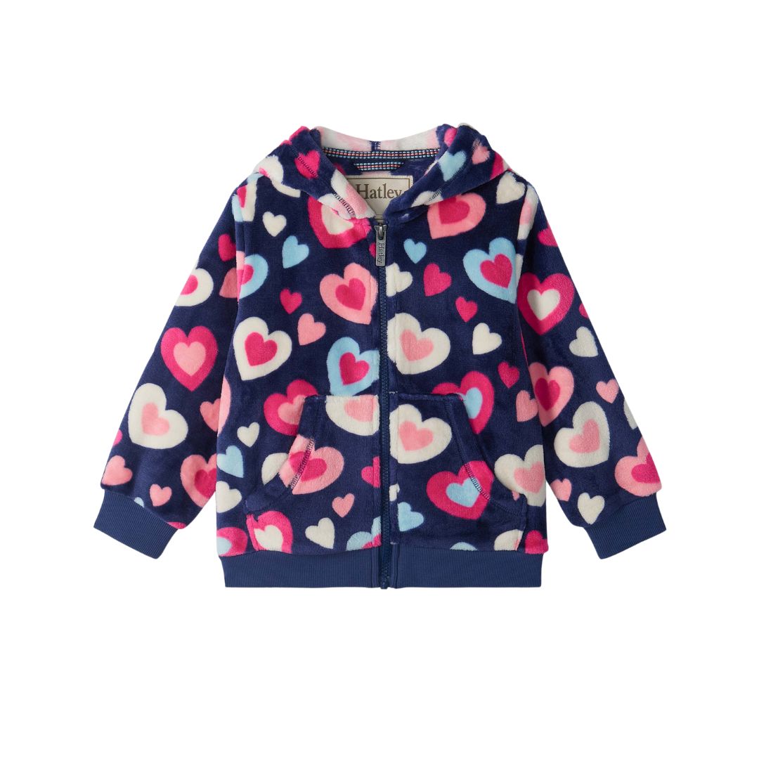 A navy blue fleece zip-up hoodie for kids, featuring an all-over heart pattern in pink, light pink, and light blue. The hoodie has a front zipper, a hood, and two front pockets, shown flat on a white background.