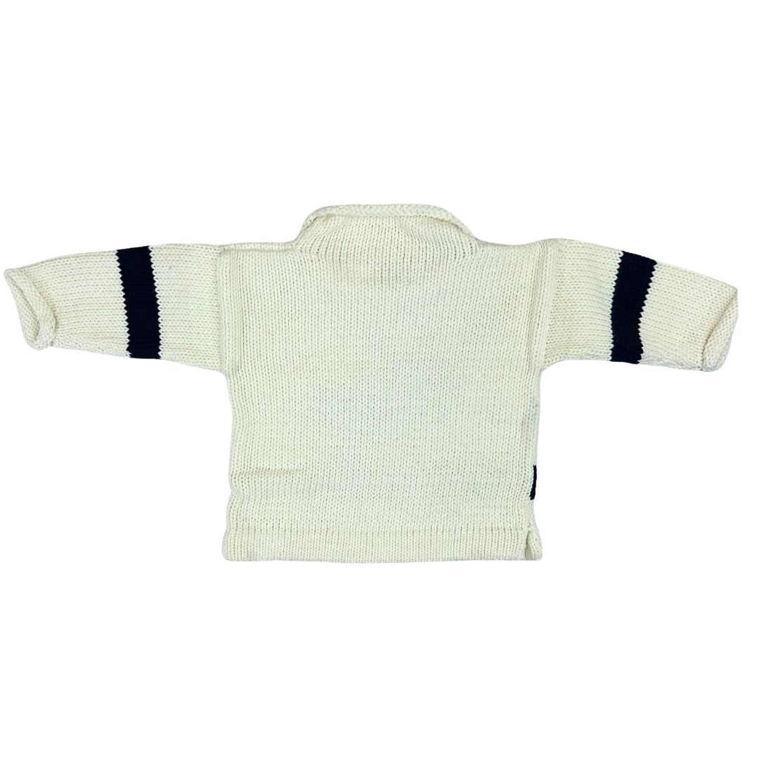 Light ivory baby sweater with dark black stripes on sleeves against a white background