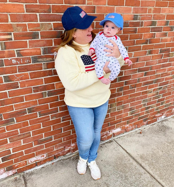 woman wearing ivory american flag sweater