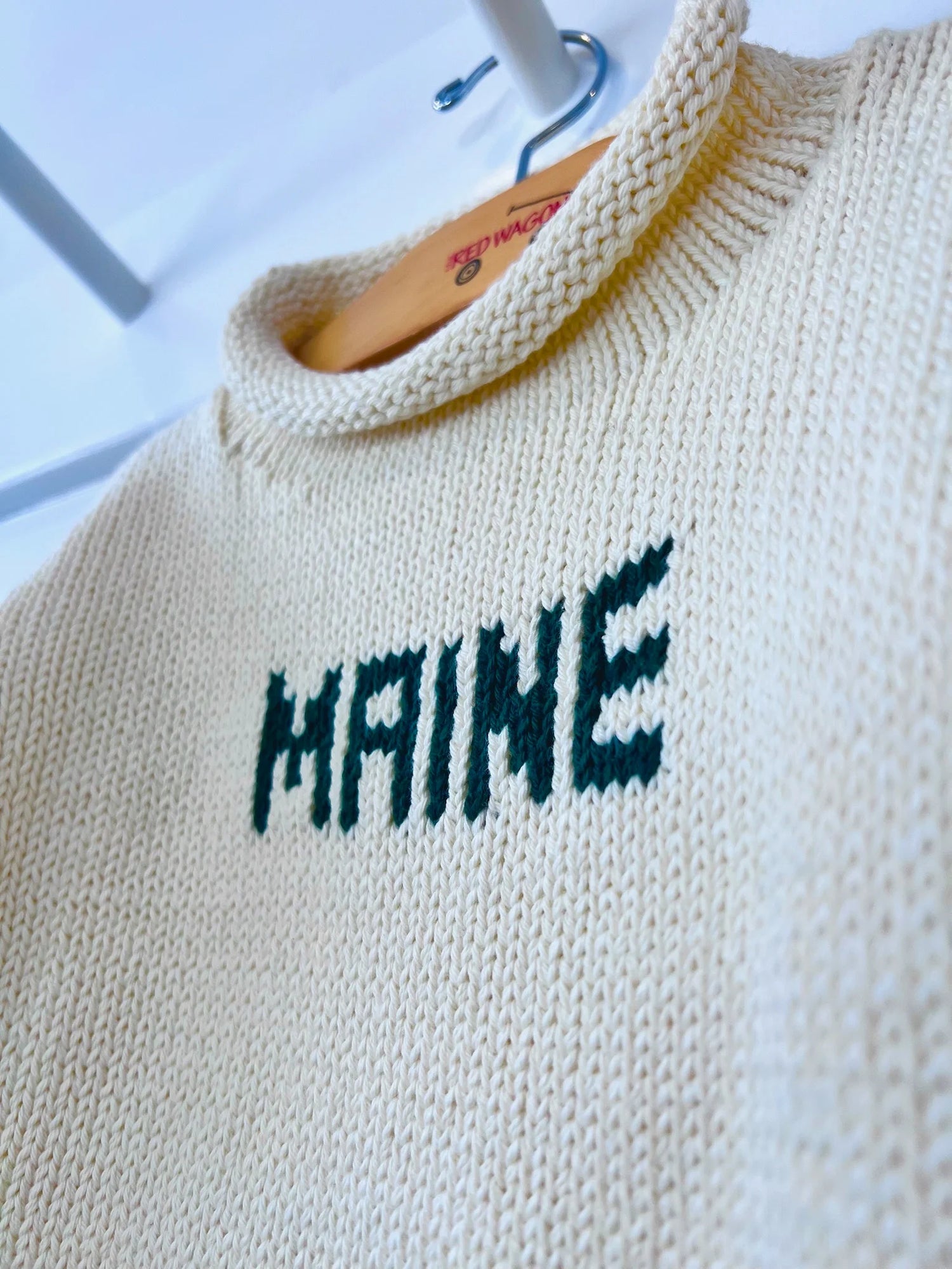 ivory sweater with hunter green MAINE