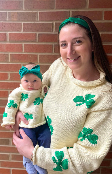 mom wearing sweater and matching with baby