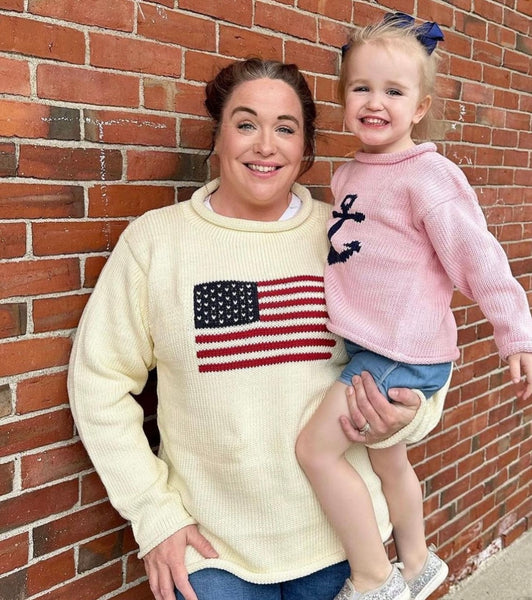 woman wearing sweater and daughter is wearing pink anchor sweater
