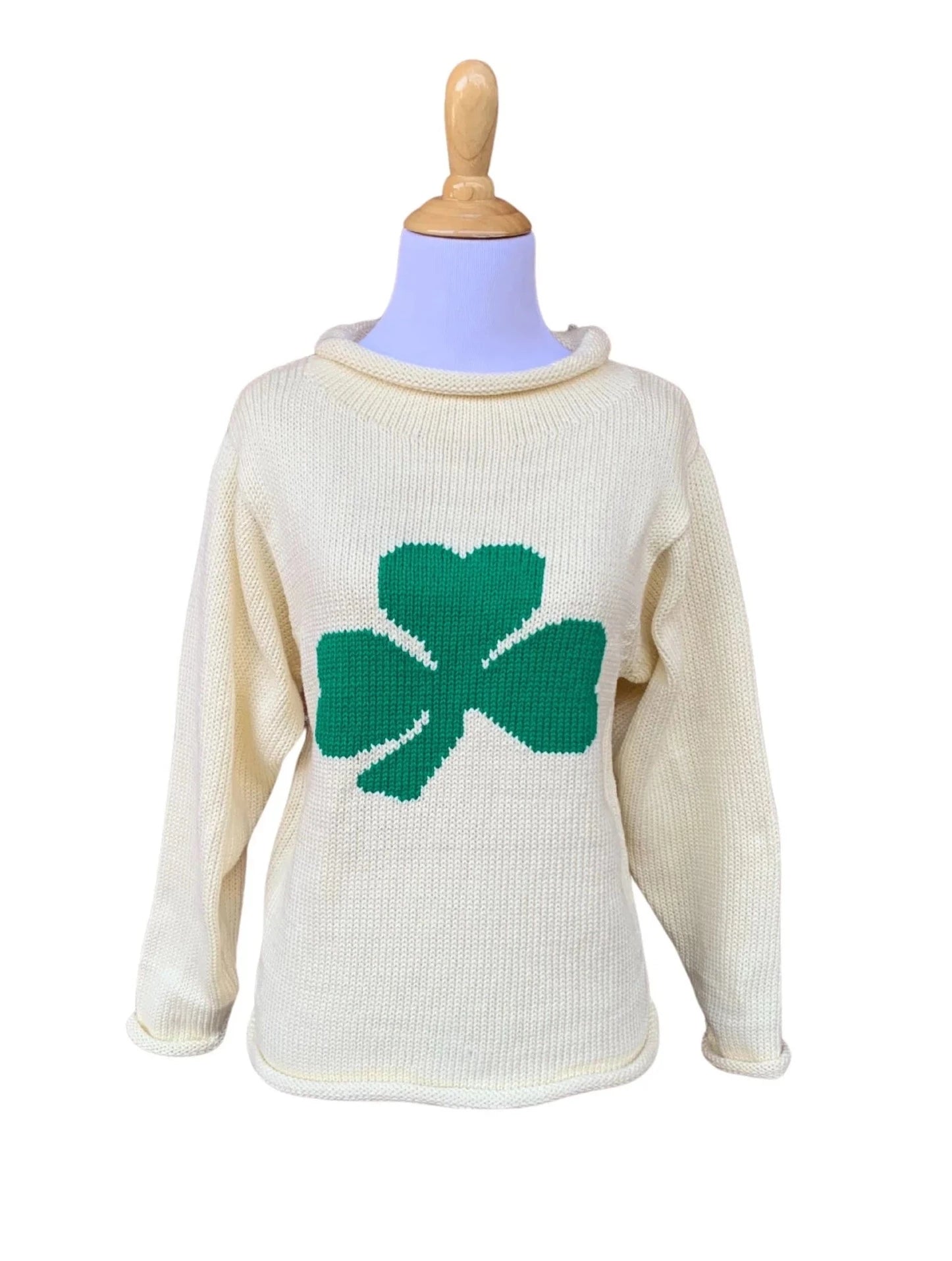long sleeve ivory sweater with single green shamrock in center