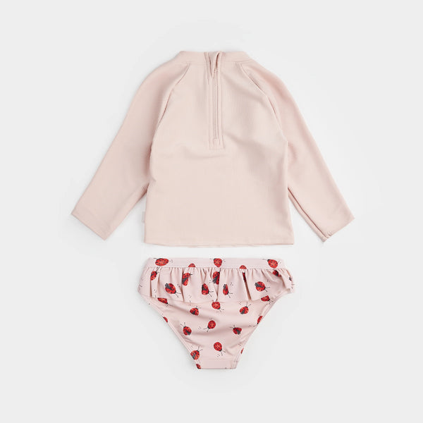 pink rashguard top and ladybug bottom baby swimsuit