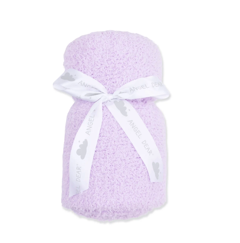 A light purple textured baby blanket wrapped in a white ribbon printed with the brand name &
