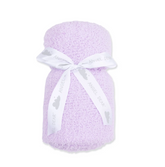 A light purple textured baby blanket wrapped in a white ribbon printed with the brand name &
