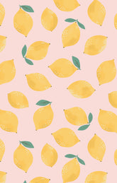 Pattern of yellow lemons with green leaves on a pink background