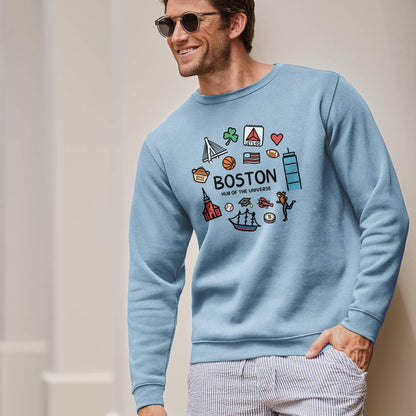 A man wearing a light blue crewneck sweatshirt with a colorful &