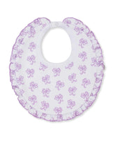 white bib with lilac bows all over and ruffle trim