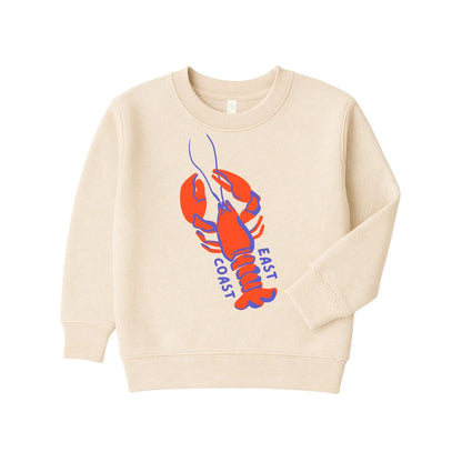 A cream-colored crewneck sweatshirt featuring a graphic of a red and blue lobster with the words &