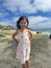 girl on the beach wearing lobster dress