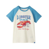 white shirt with blue sleeves and lobster shack words on front with large red lobster, also says "fried fish & chips" and says est 1986