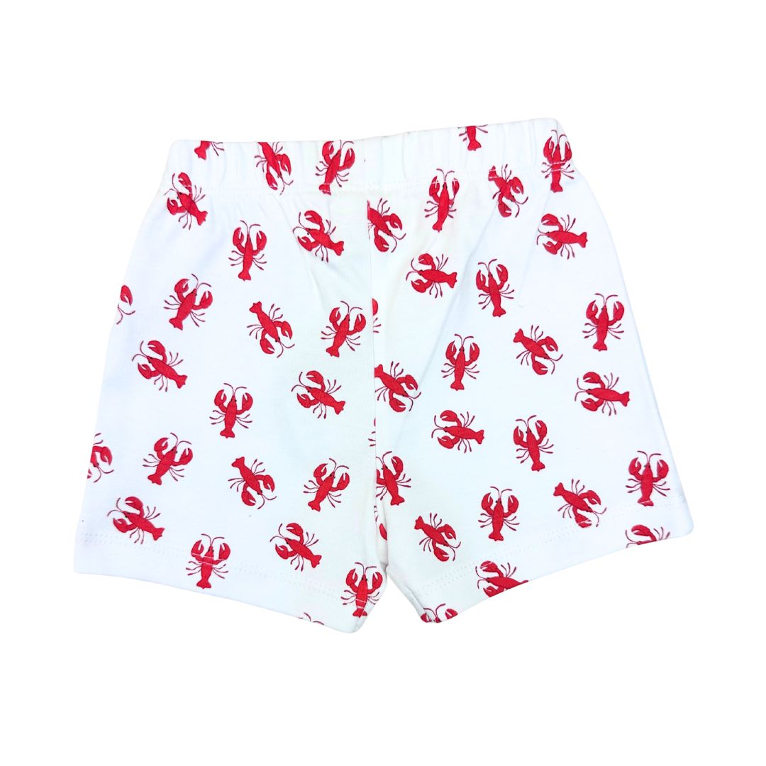 White shorts with red lobster pattern on a white background